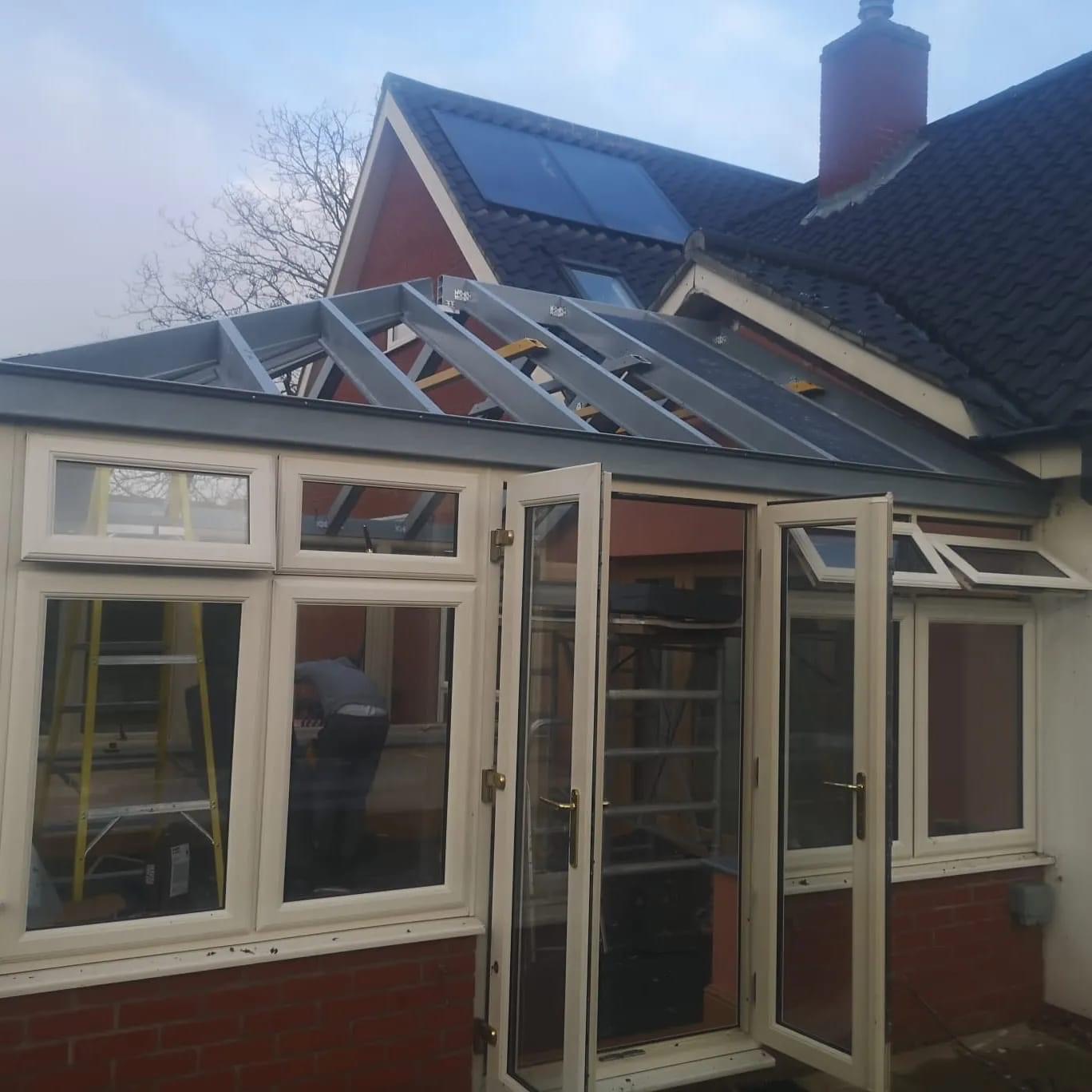Conservatory roof without tiles and open door