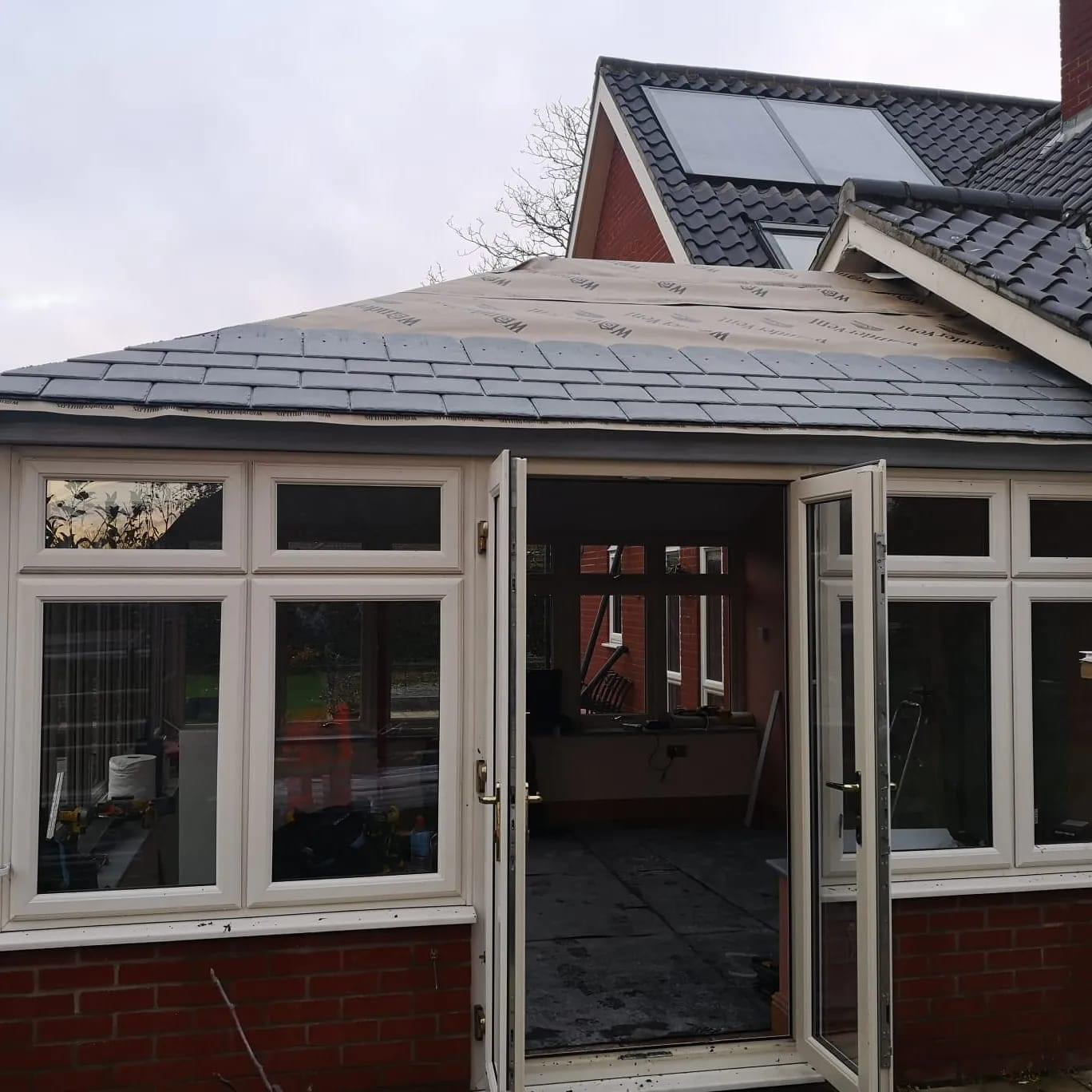 Tiled conservatory roof with door open