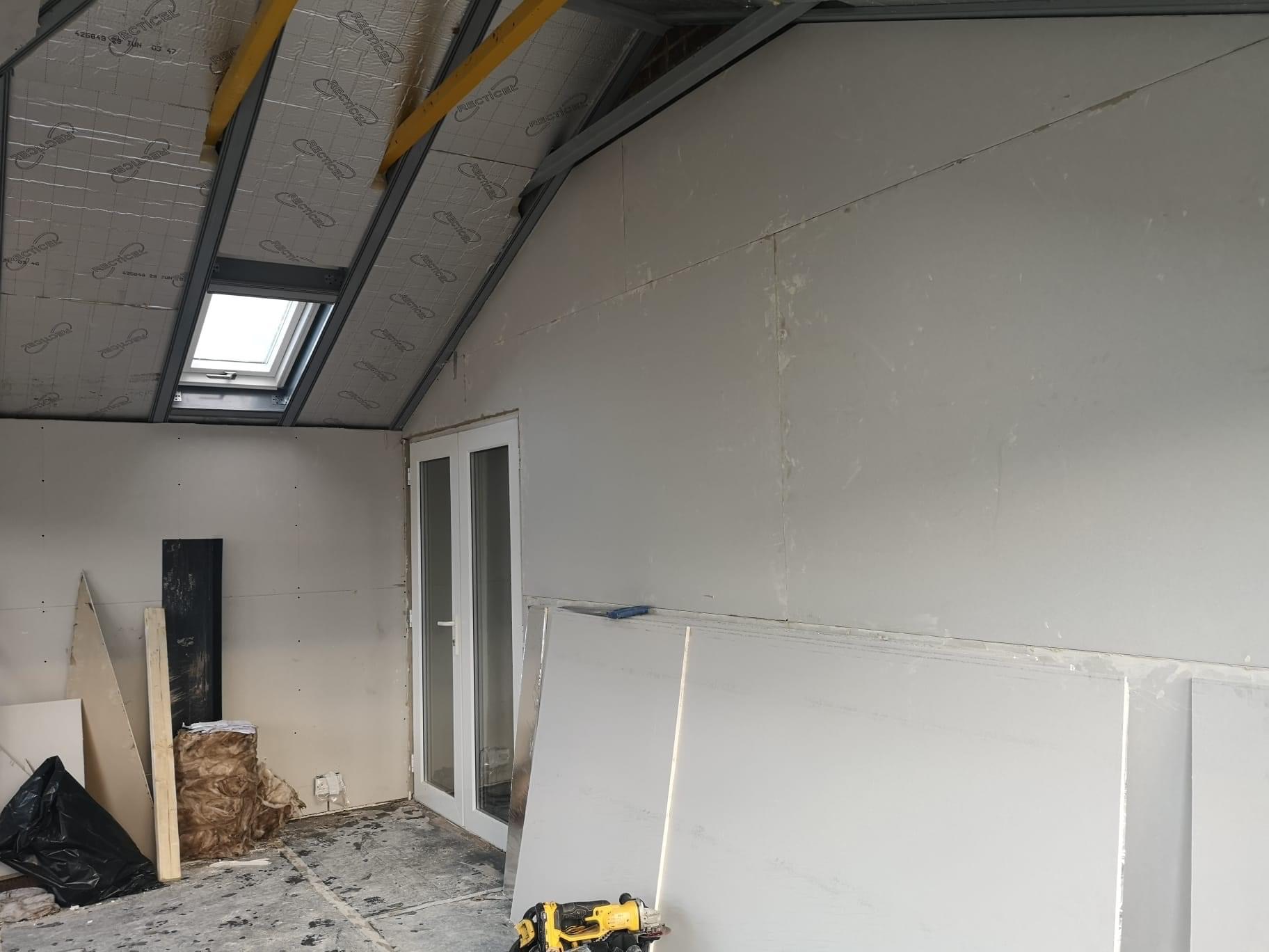 View of conservatory under construction with plaster boards